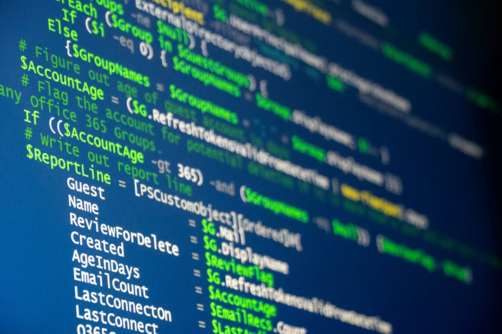 Developer at a terminal, code on monitor